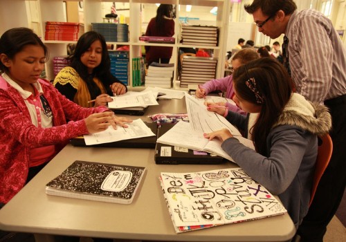 Students working with teacher